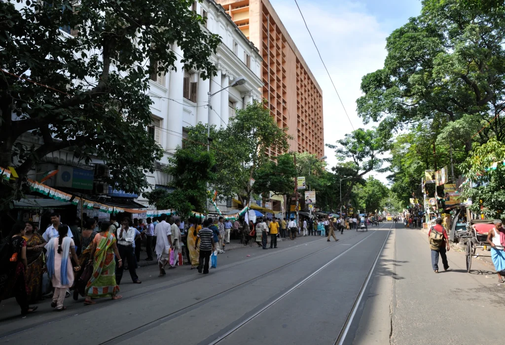College Street book market in Kolkata with second-hand book stalls and pedestrians.