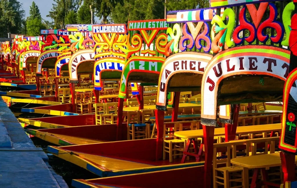 Colorful trajineras on the canals of Xochimilco in Mexico City.